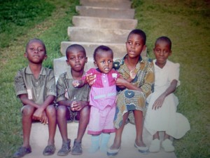 Consolee Consolee Nishimwe, second from right, sits with her sisters and brothers in front of her Rwandan home in 1993, just a few months before the genocide began. The house was destroyed; her brothers were all killed. This is the only photo she still has of them.
